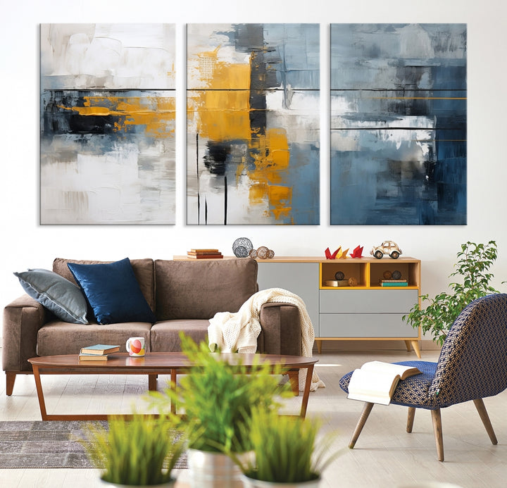 The Orange Abstract Wall Art Print features a series of white, blue, black, and yellow blocks arranged in a triptych format on museum-quality canvases. Proudly made in the USA and offered with free shipping.