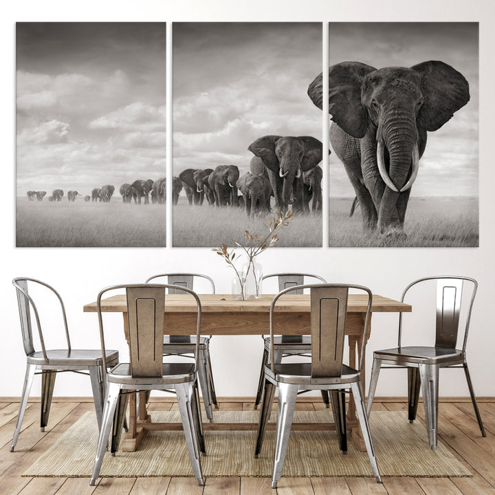 The Elephant Wall Art Canvas Print features a triptych of elephants in a savanna, elegantly displayed.