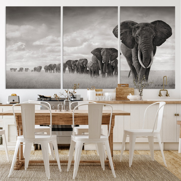 The Elephant Wall Art Canvas Print features a triptych of elephants in a savanna, elegantly displayed.