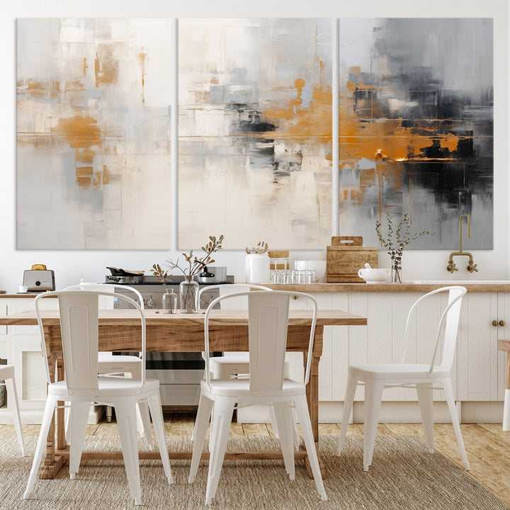 The Orange Pastel Abstract Wall Art Canvas Print, featuring a triptych of orange, white, and black hues, is elegantly displayed on museum-quality canvas.