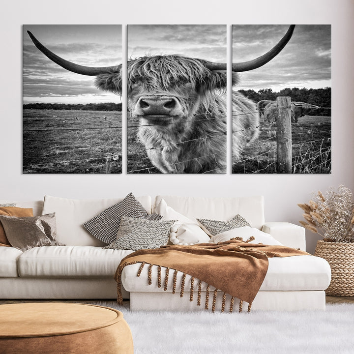 The "Scottish Highland Cow Canvas Wall Art Farmhouse Decor" adds a touch of rustic charm to your living room wall above the couch.