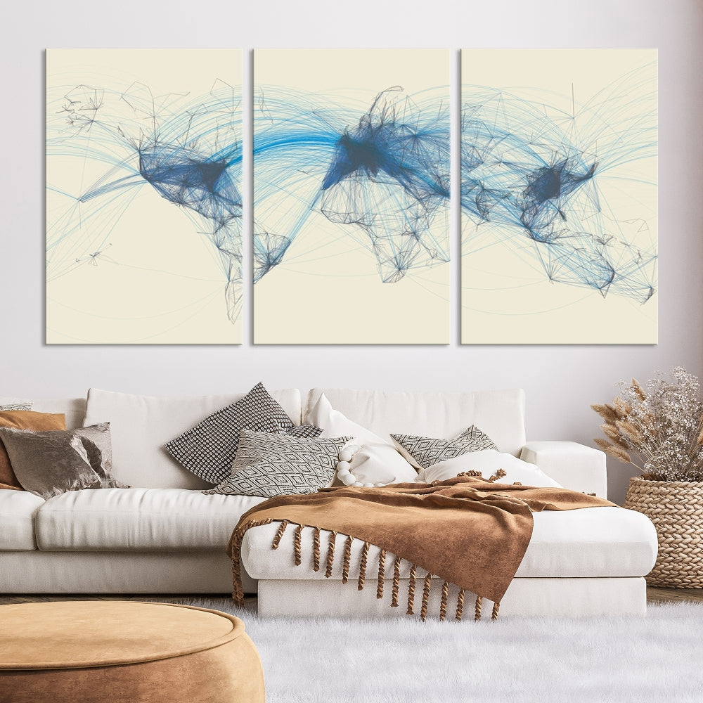 The Flight Routes Map art, featuring an abstract world map with blue connections representing global networks, is a three-panel canvas wall art piece.