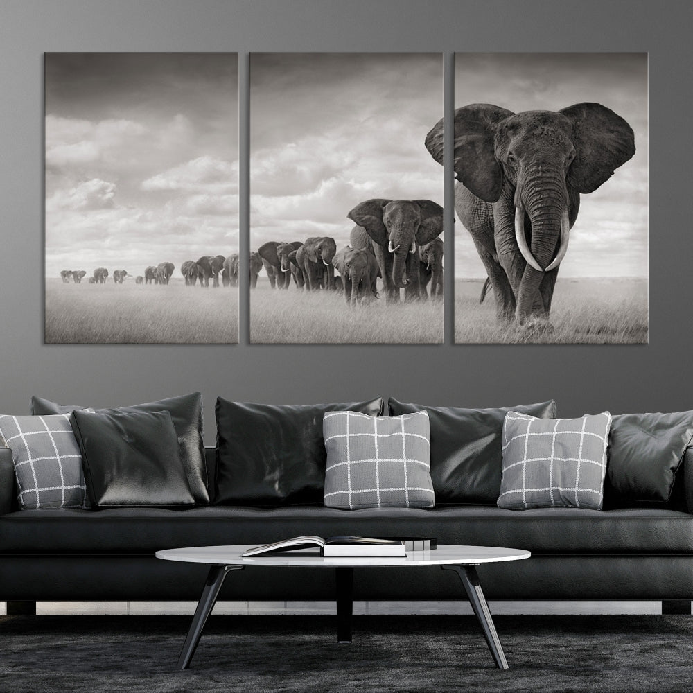 The Elephant Wall Art Canvas Print features a triptych of elephants in a savanna, elegantly displayed.