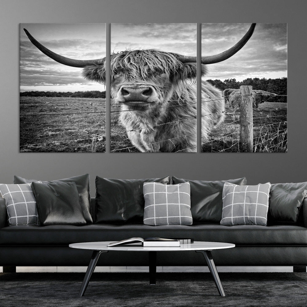 The "Scottish Highland Cow Canvas Wall Art Farmhouse Decor" adds a touch of rustic charm to your living room wall above the couch.