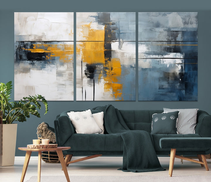 The Orange Abstract Wall Art Print features a series of white, blue, black, and yellow blocks arranged in a triptych format on museum-quality canvases. Proudly made in the USA and offered with free shipping.