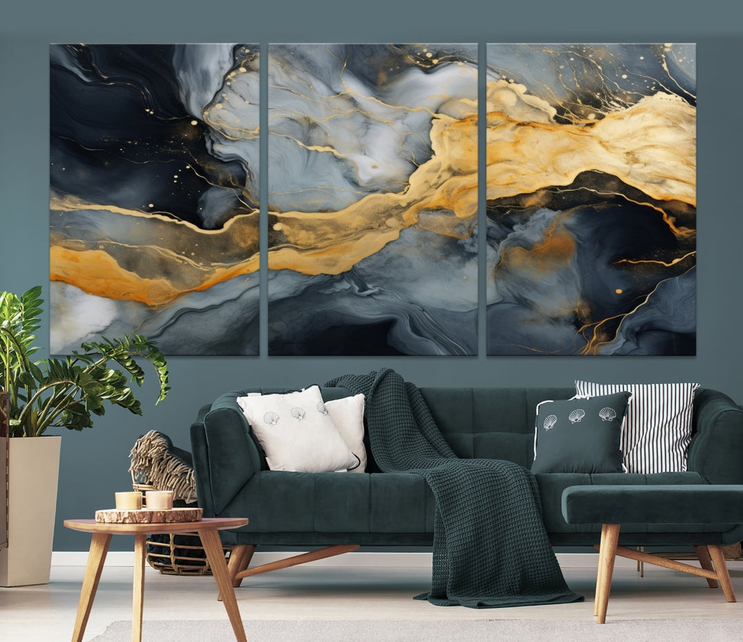 The living room features the Golden Gray Abstract Wall Art Print Contemporary Art Canvas Design, a triptych showcasing gold, black, and gray swirls. Crafted on museum-quality canvas and ready to hang, this piece is designed for elegance and durability.