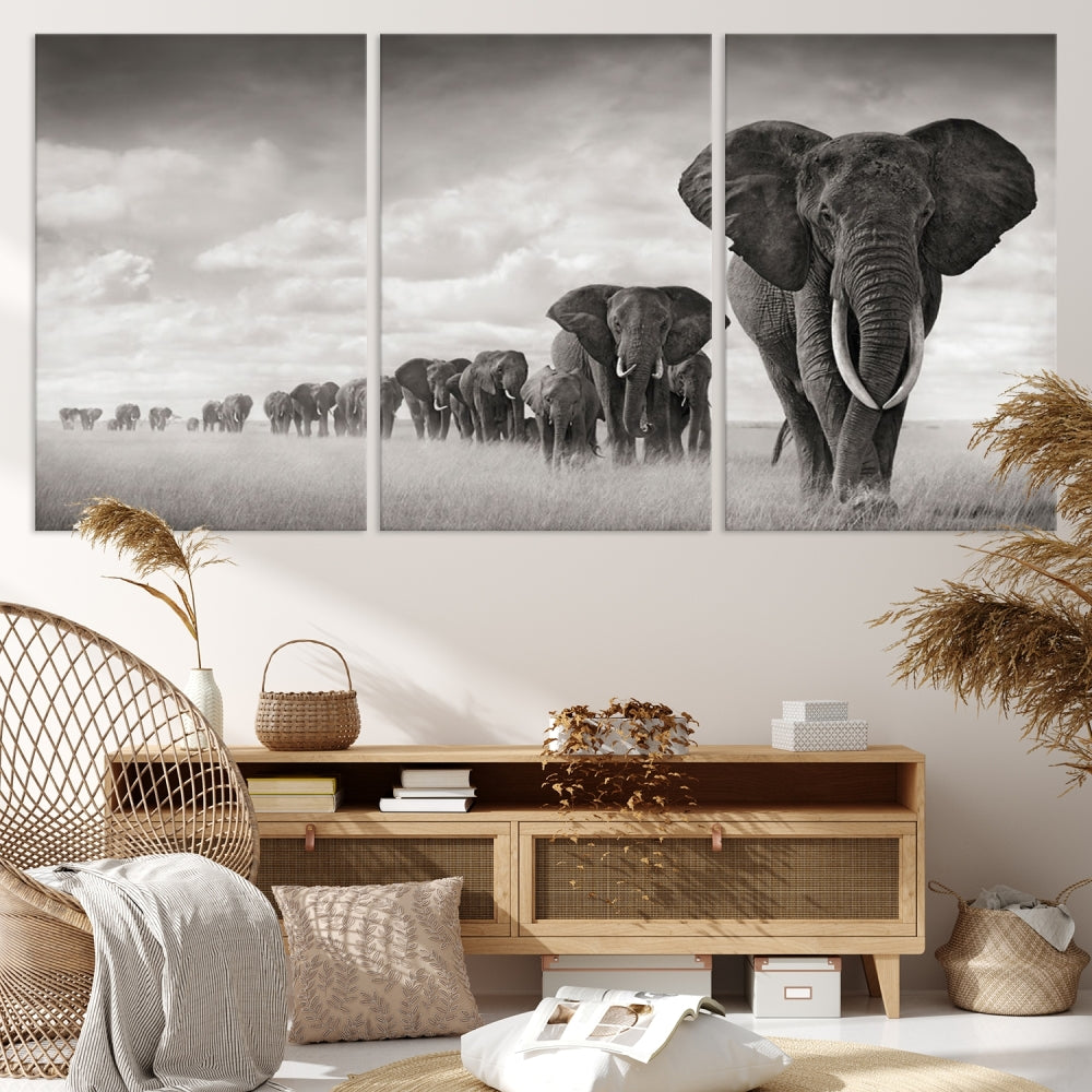 The "Herd of Elephants Wall Art Canvas Print" features an elegant black and white triptych of elephants walking in a line, beautifully displayed on museum-quality canvas with a UV-protective coating. This artwork arrives ready to hang and adds sophistication to any space.