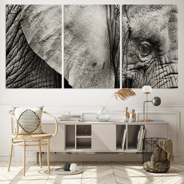 A modern living room features a large Elephant Wall Art Canvas Print in black and white, crafted on museum-quality canvases with UV-protective coating to maintain its elegance.