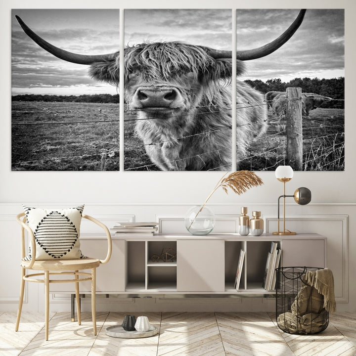 The "Scottish Highland Cow Canvas Wall Art Farmhouse Decor" adds a touch of rustic charm to your living room wall above the couch.