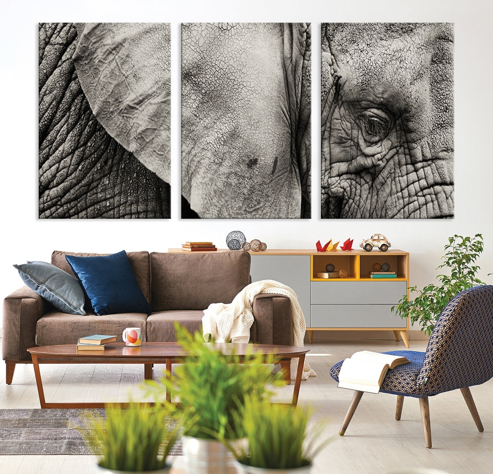 A modern living room features a large Elephant Wall Art Canvas Print in black and white, crafted on museum-quality canvases with UV-protective coating to maintain its elegance.