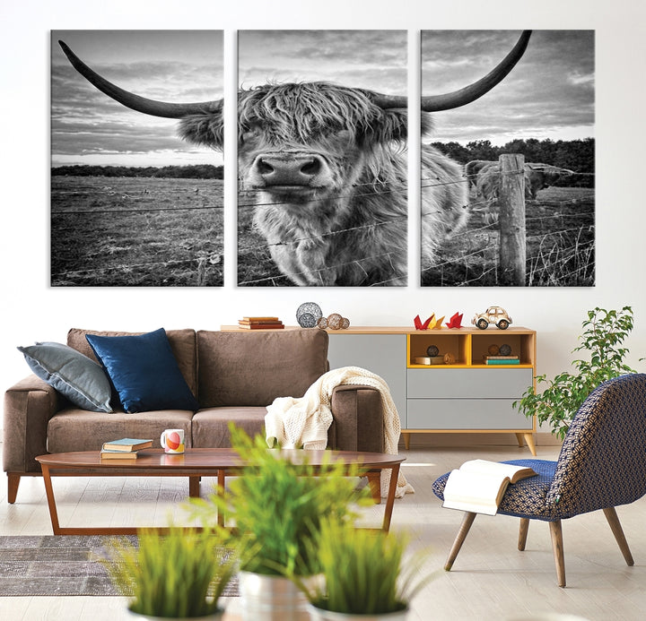 The "Scottish Highland Cow Canvas Wall Art Farmhouse Decor" adds a touch of rustic charm to your living room wall above the couch.