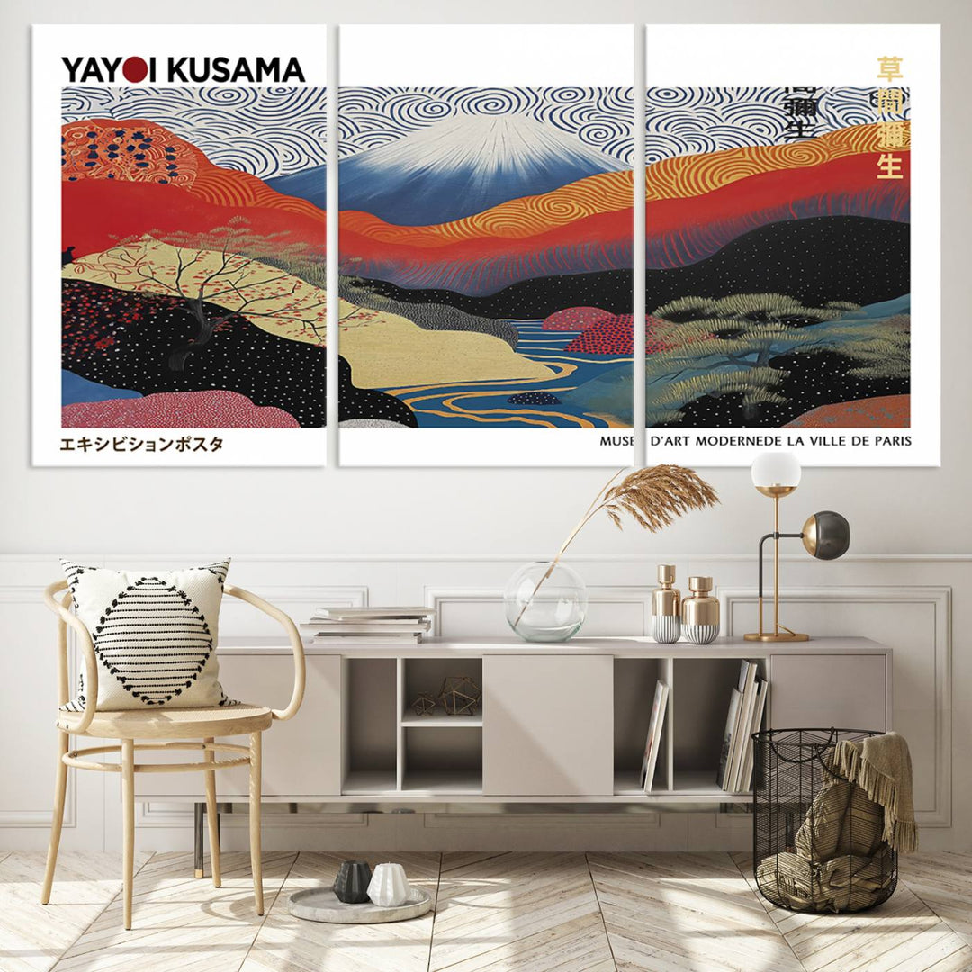 The vibrant abstract landscape canvas print featuring the Framed Yayoi Kusama 1986 Wall Art adds a touch of contemporary décor to the room.