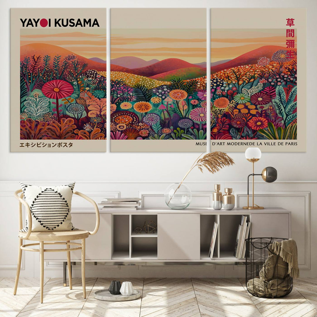 The room is adorned with a triptych artwork depicting colorful flowers and hills, incorporating the "Framed Yayoi Kusama 1986 Wall Art Print" – a vibrant abstract landscape canvas print that blends Japanese Wabi Sabi themes into contemporary nature-inspired décor.