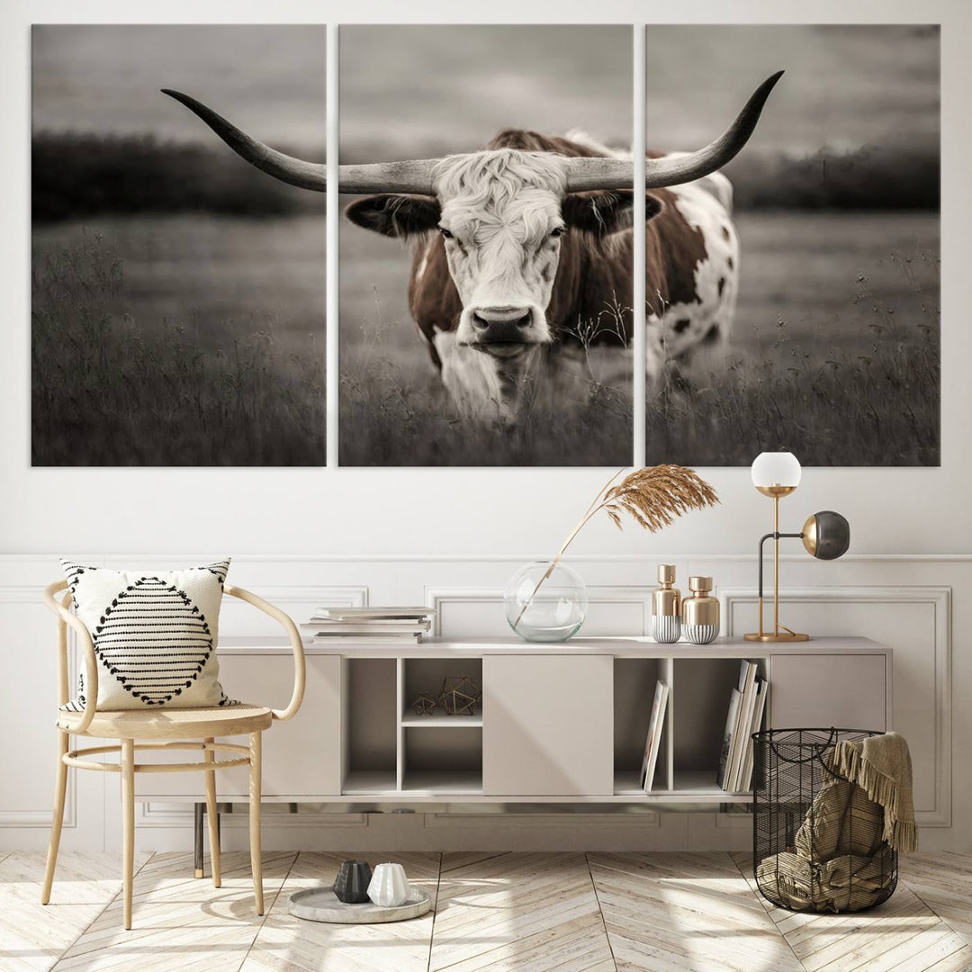 The Texas Longhorn Cow Canvas Wall Art Print adds a rustic touch to a living room.