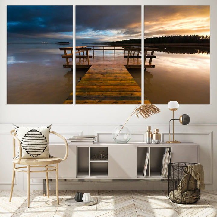 The "Serene Lake Pier at Sunset" landscape canvas print, crafted as ready-to-hang and framed wall art, enriches the contemporary setting by capturing the tranquility of a lakeside pier at sunset.