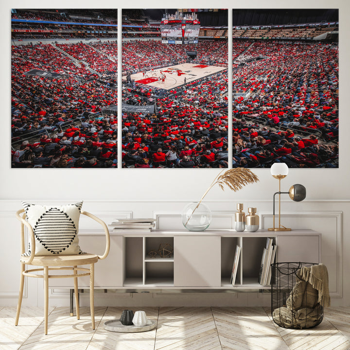 A painting of Louisville Cardinals fans in red at the KFC Yum Center Arena.