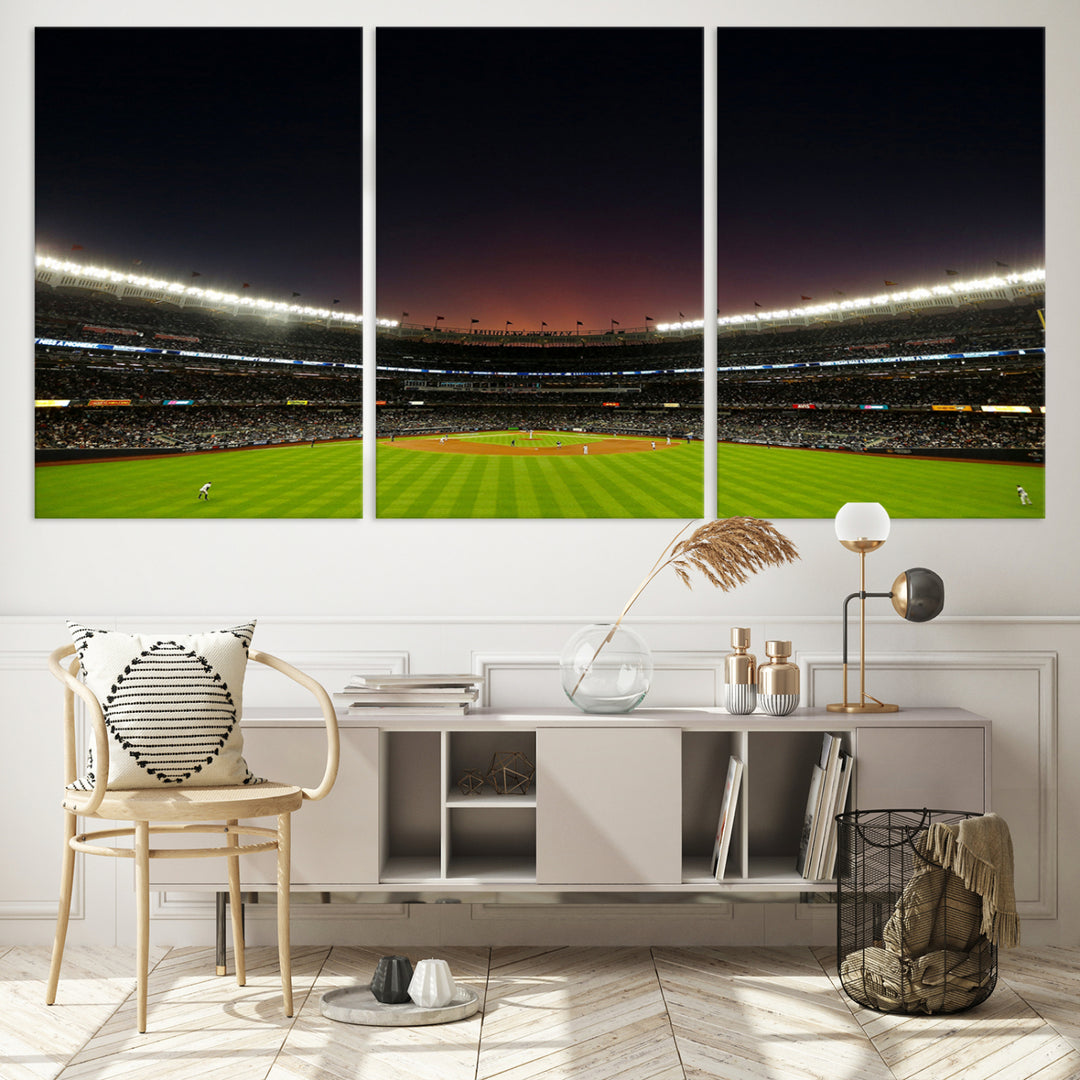 A night game at Yankee Stadium depicted on canvas beneath a sunset sky.