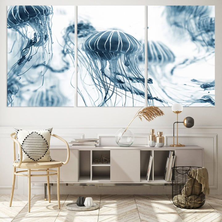 The "Abstract Jellyfish Wall Art Canvas Print" in high resolution is beautifully displayed as a triptych on a dark wall. Experience museum-quality canvas and enjoy free shipping with this stunning piece.