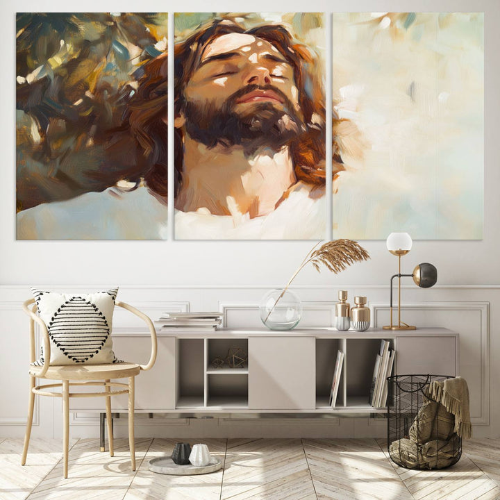 The Jesus Portrait Wall Art Canvas Print features a depiction of Jesus Christ with closed eyes, basking in sunlight. His expression exudes a peaceful, spiritual atmosphere against a blurred background.