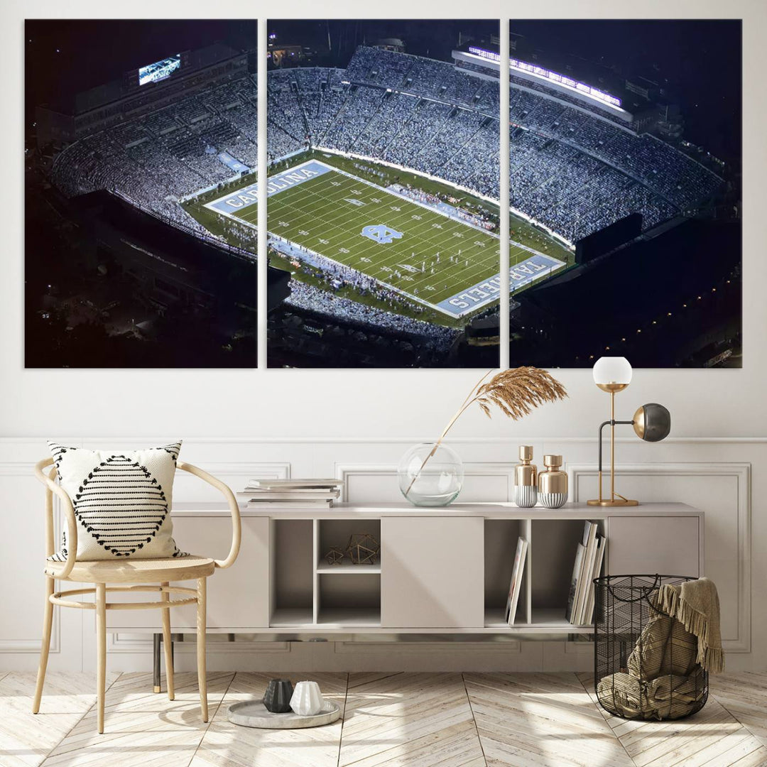 A University of North Carolina Tar Heels Football Team Print, showcasing Chapel Hill's Kenan Memorial Stadium, hangs in a modern dining room, adding a gallery-quality finish that enhances the entire space.