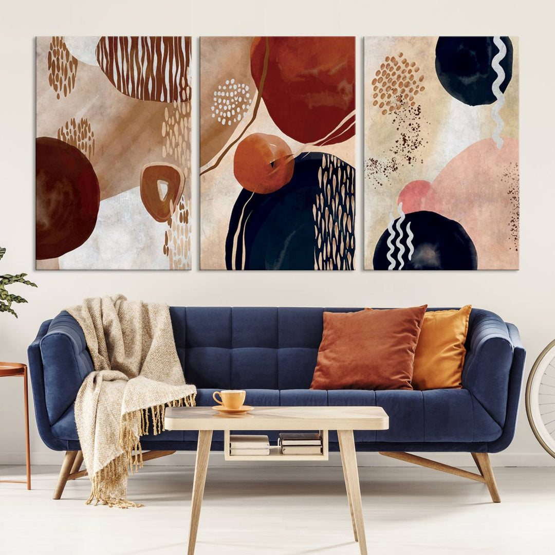 The Boho Neutral Canvas Print Set with earthy tones and circles hangs on the wall.