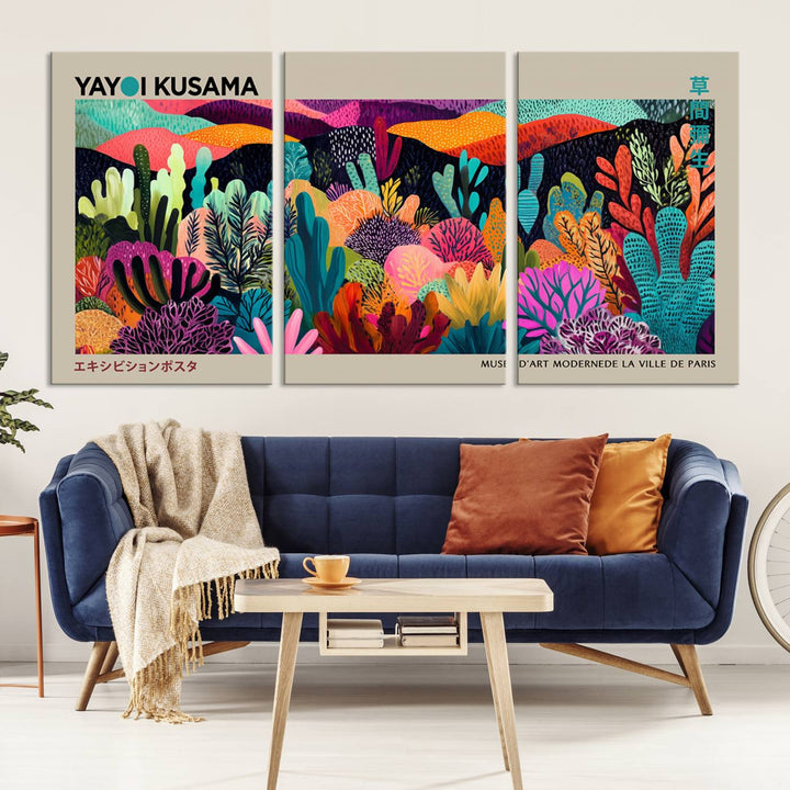 The framed Yayoi Kusama wall art adds vibrancy above the blue couch.