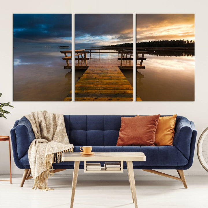 The "Serene Lake Pier at Sunset" landscape canvas print, crafted as ready-to-hang and framed wall art, enriches the contemporary setting by capturing the tranquility of a lakeside pier at sunset.