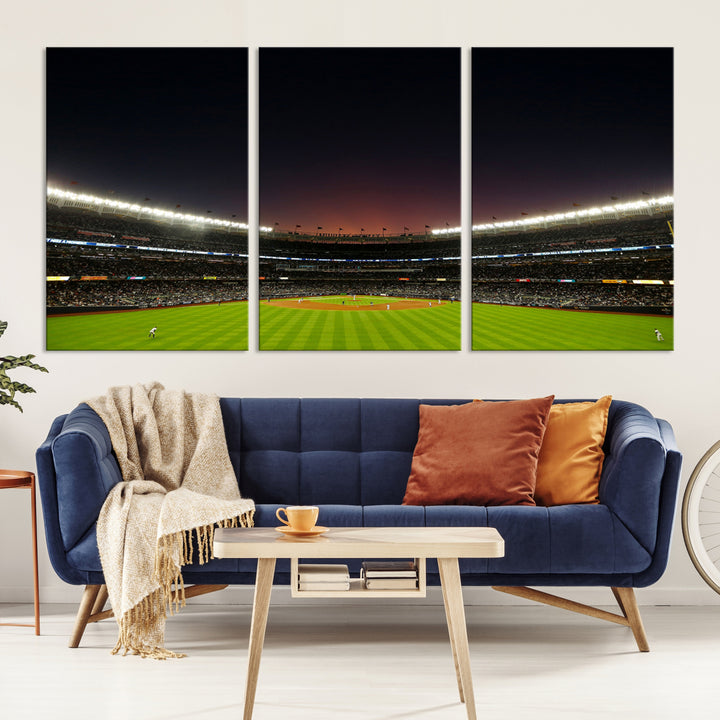 A night game at Yankee Stadium depicted on canvas beneath a sunset sky.