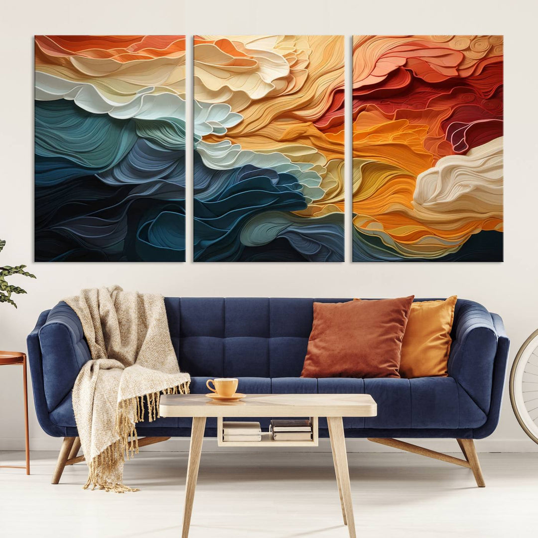 A Blue Orange Abstract Wave Wall Art Canvas Print adorns the wall. This colorful masterpiece is professionally hand-assembled to enhance any space.