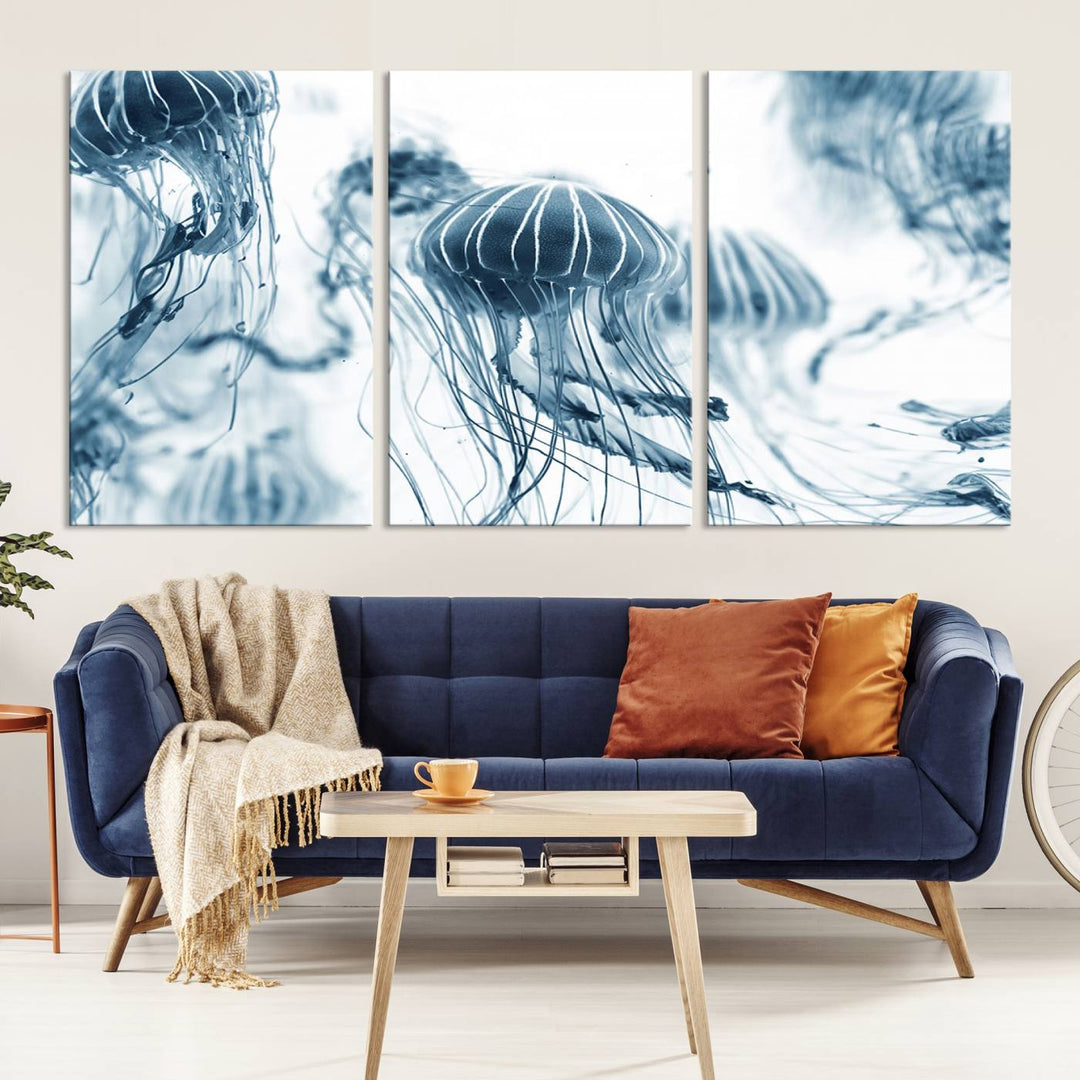 The "Abstract Jellyfish Wall Art Canvas Print" in high resolution is beautifully displayed as a triptych on a dark wall. Experience museum-quality canvas and enjoy free shipping with this stunning piece.