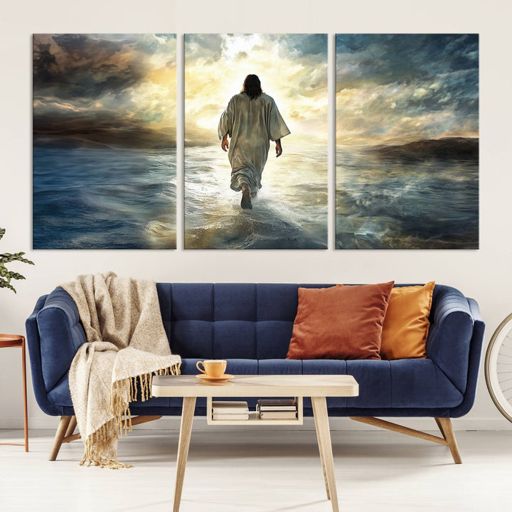 The Jesus Walking on Water Wall Art, a captivating triptych canvas print, showcases a person walking on water beneath dramatic clouds. This ready-to-hang piece seamlessly combines faith and style for your Christian home decor.