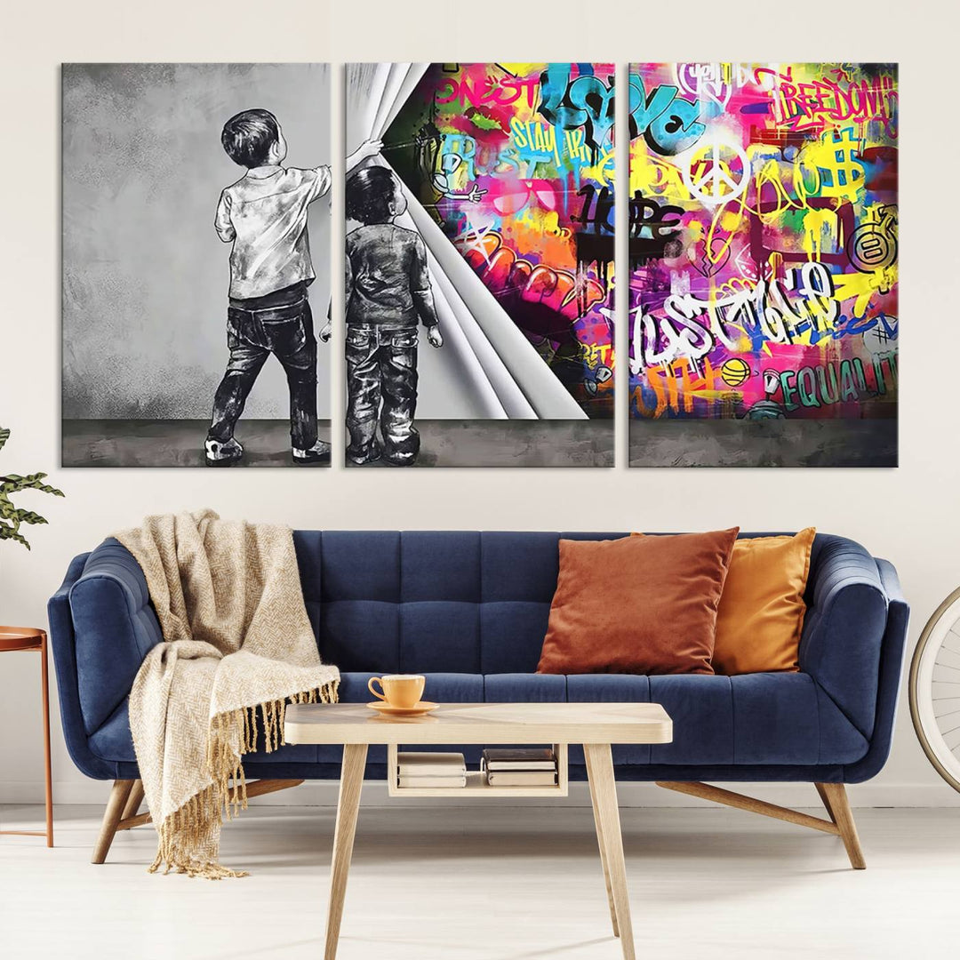 The Banksy Print - Street Art Canvas features a vibrant and bold image of two children lifting a curtain to reveal colorful graffiti. It's ready to hang, adding an urban modern decor vibe.