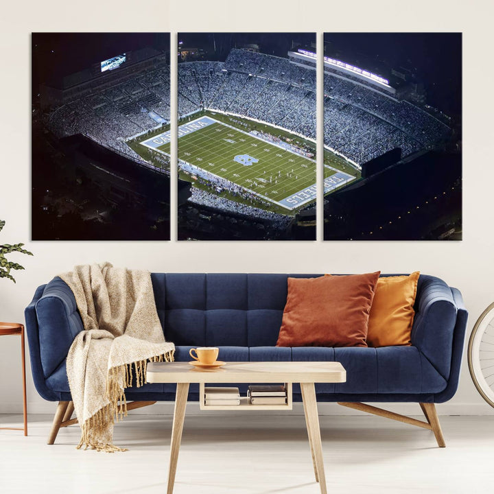 A University of North Carolina Tar Heels Football Team Print, showcasing Chapel Hill's Kenan Memorial Stadium, hangs in a modern dining room, adding a gallery-quality finish that enhances the entire space.