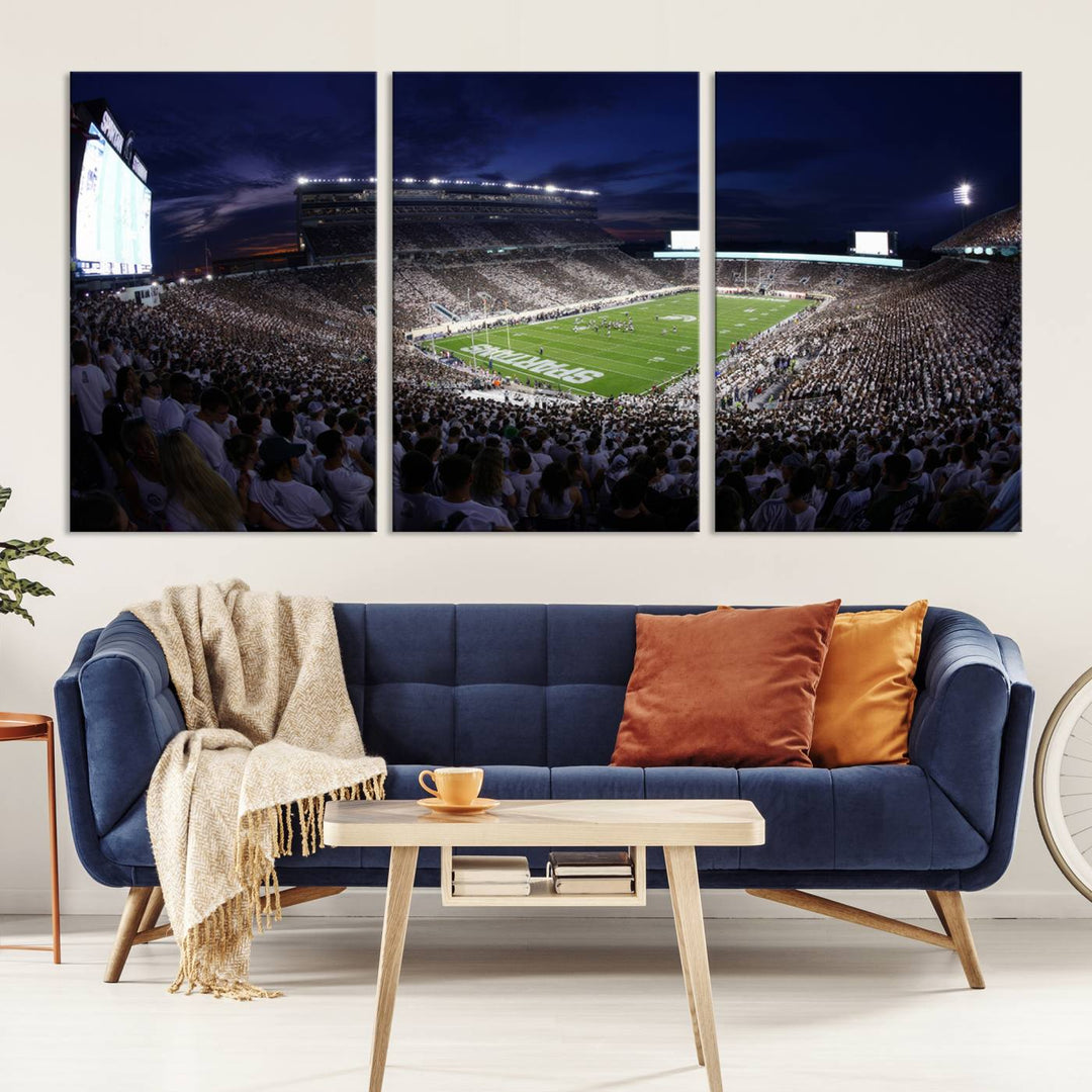 A packed football stadium at night, with bright lights and fans in white, depicted in a Michigan State Spartans Stadium wall art.