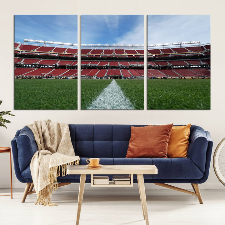 A canvas print of the University of Tulsa Golden Hurricane showcases H.A. Chapman Stadiums football field and red seats against a backdrop of a blue sky.