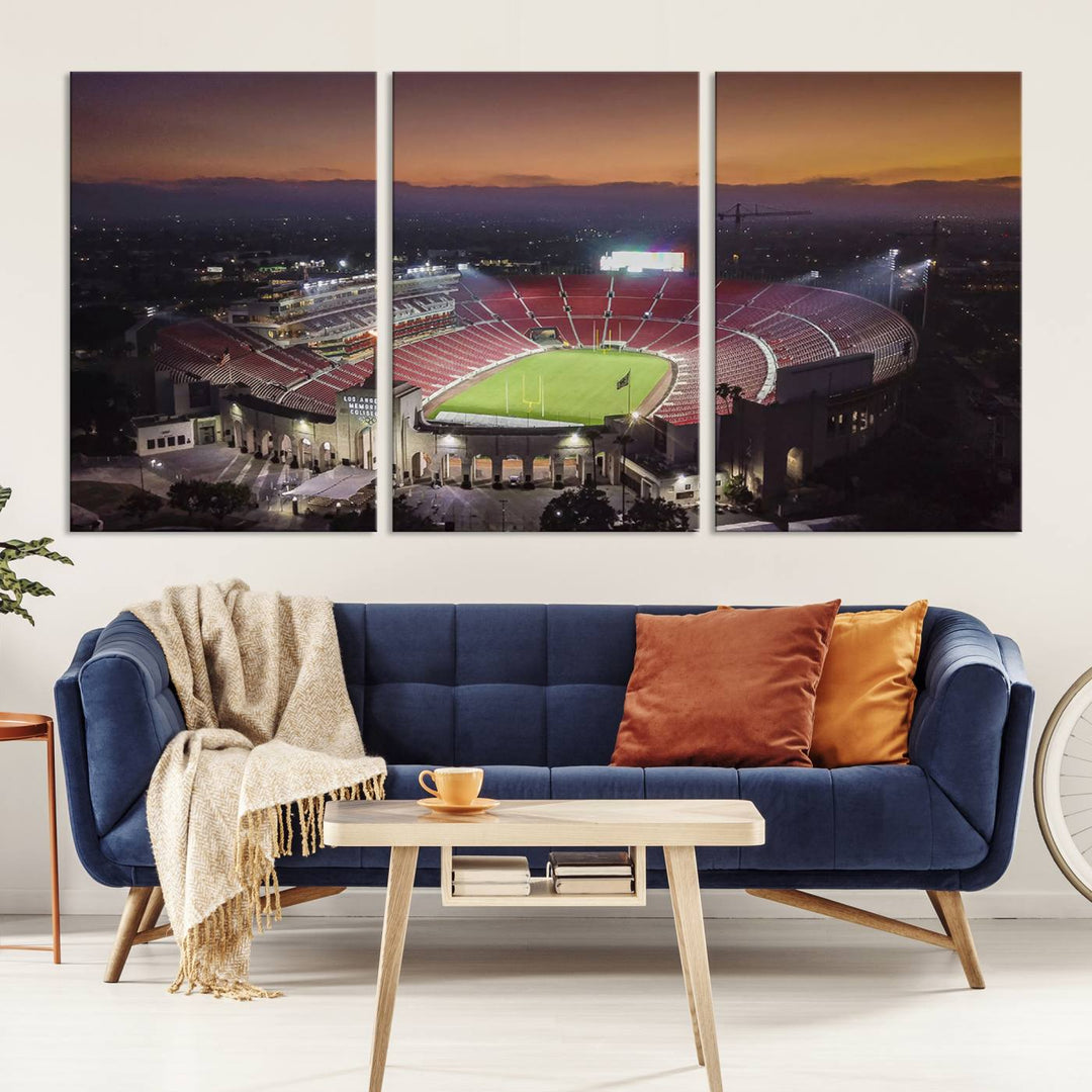 The USC Trojans Stadium canvas captures Memorial Coliseum at twilight, showcasing red seats and a green field beneath an orange sky.