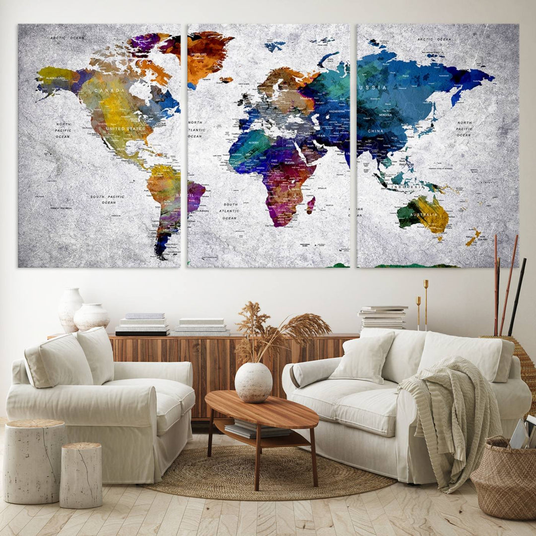 The World Map Art Canvas Print, featuring country names on a grunge-stained gray background, is perfect for stylish home decor.