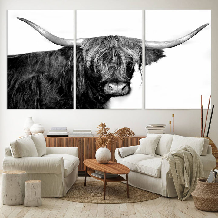 The Black and White Highland Cow Multi Panel Wall Art Canvas Print with UV-protection hangs prominently.