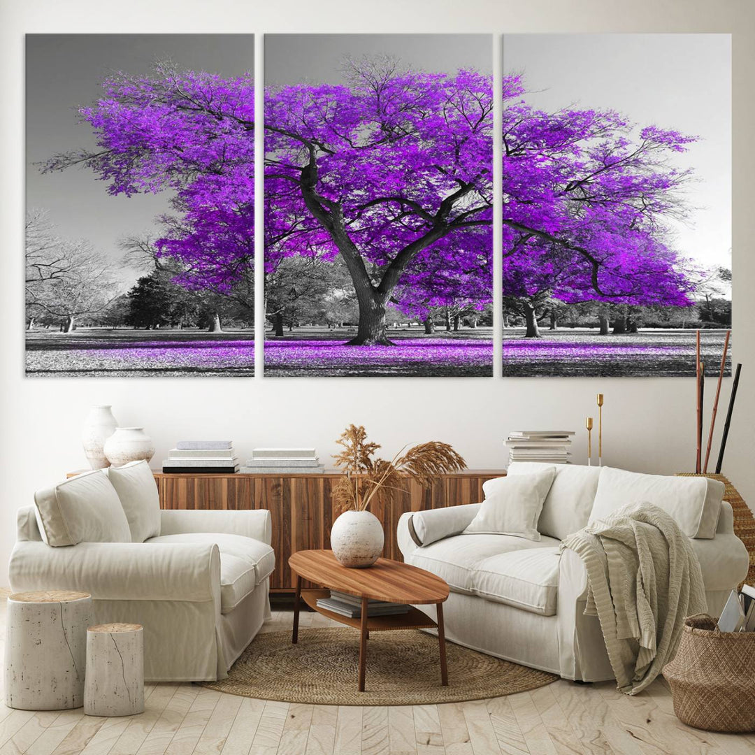 The Big Purple Tree Wall Art Canvas Print showcases a vibrant purple tree set against a black-and-white landscape.