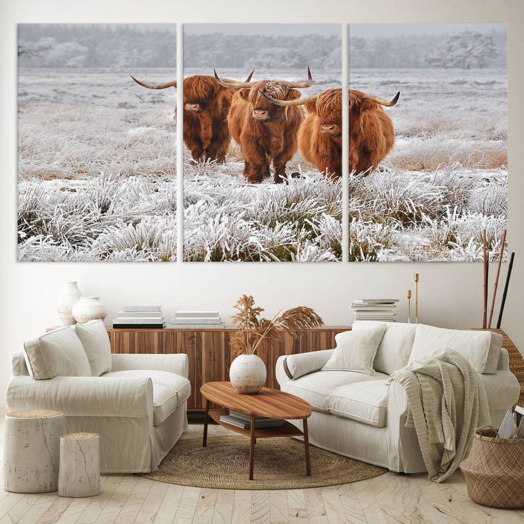 The Highland Cows in Snow canvas showcases three cattle in a frosty field.