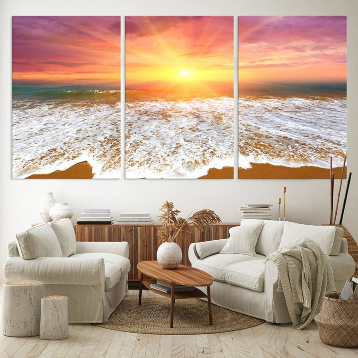 Golden Beach Sunrise 3-panel canvas art of ocean waves, hung on a wooden wall.