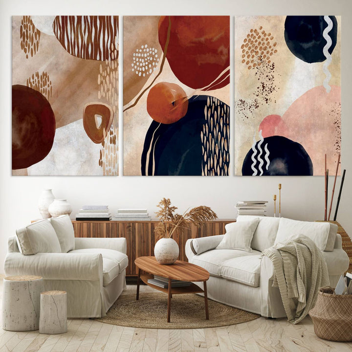 The Boho Neutral Canvas Print Set with earthy tones and circles hangs on the wall.