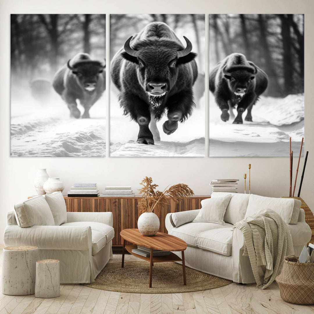 The Buffalo Wall Art Canvas Print of bison running through snow adorns the wall.