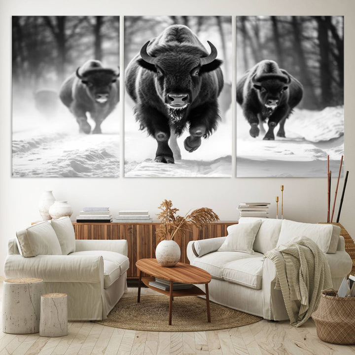 The Buffalo Wall Art Canvas Print of bison running through snow adorns the wall.