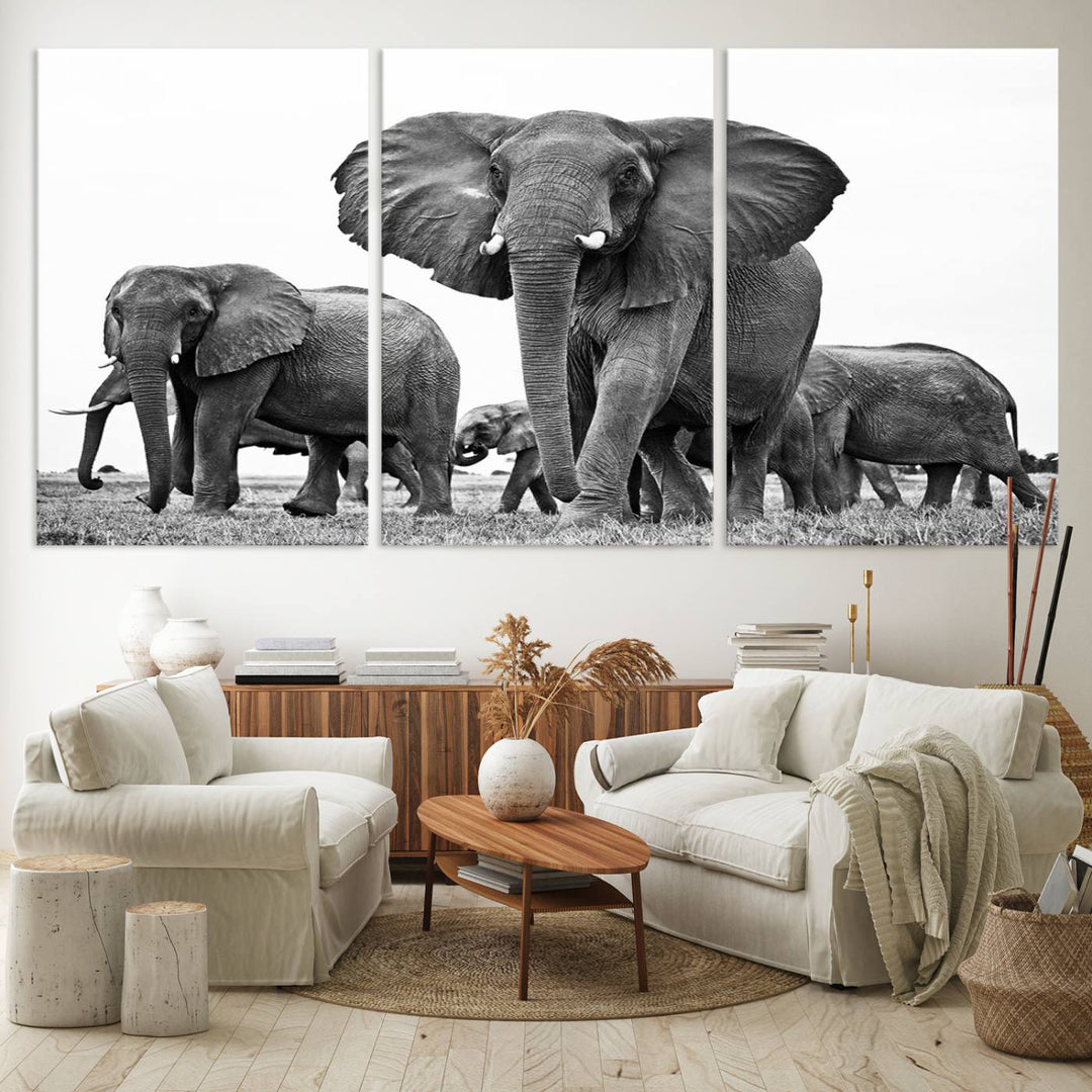 A modern dining area features a Black White Elephant Family Wall Art Canvas Print.