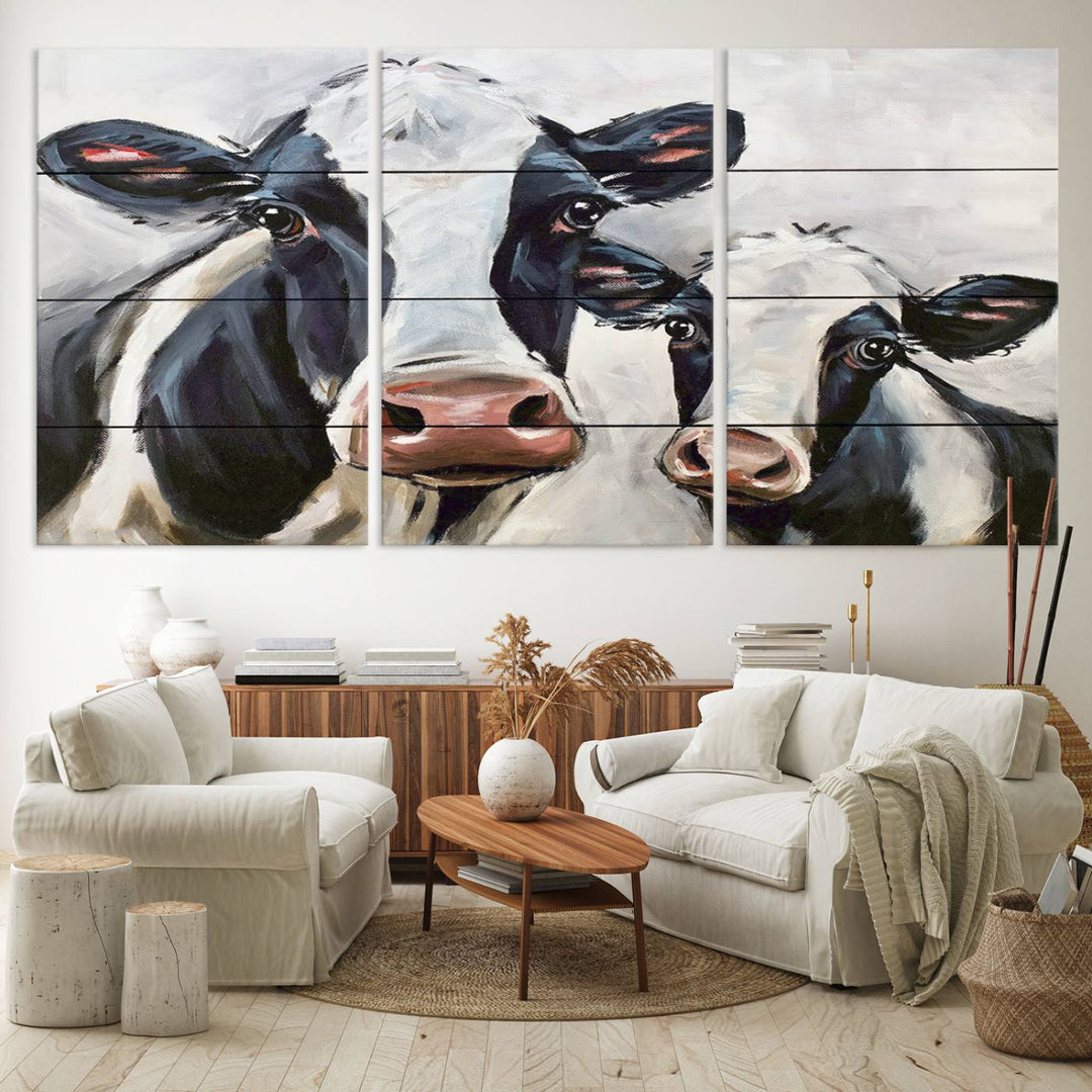 The Vintage Baby and Mom Cattle Canvas, featuring cows with black and white patches, is a prominent piece of wall art.