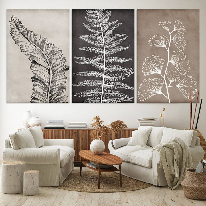 Three framed botanical wall art pieces are displayed in a bright room.