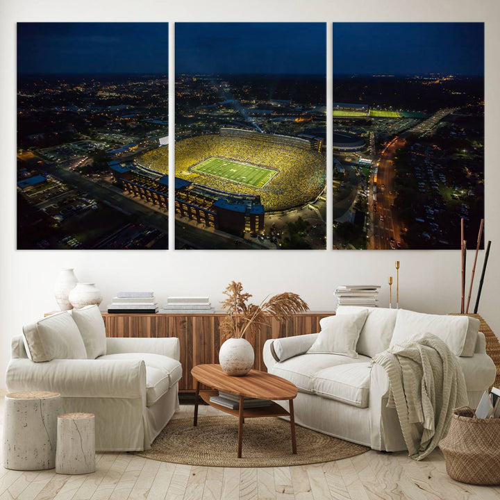 Aerial view of Michigan Stadium at night, surrounded by city lights, depicted on a Michigan Wolverines wall art canvas print.