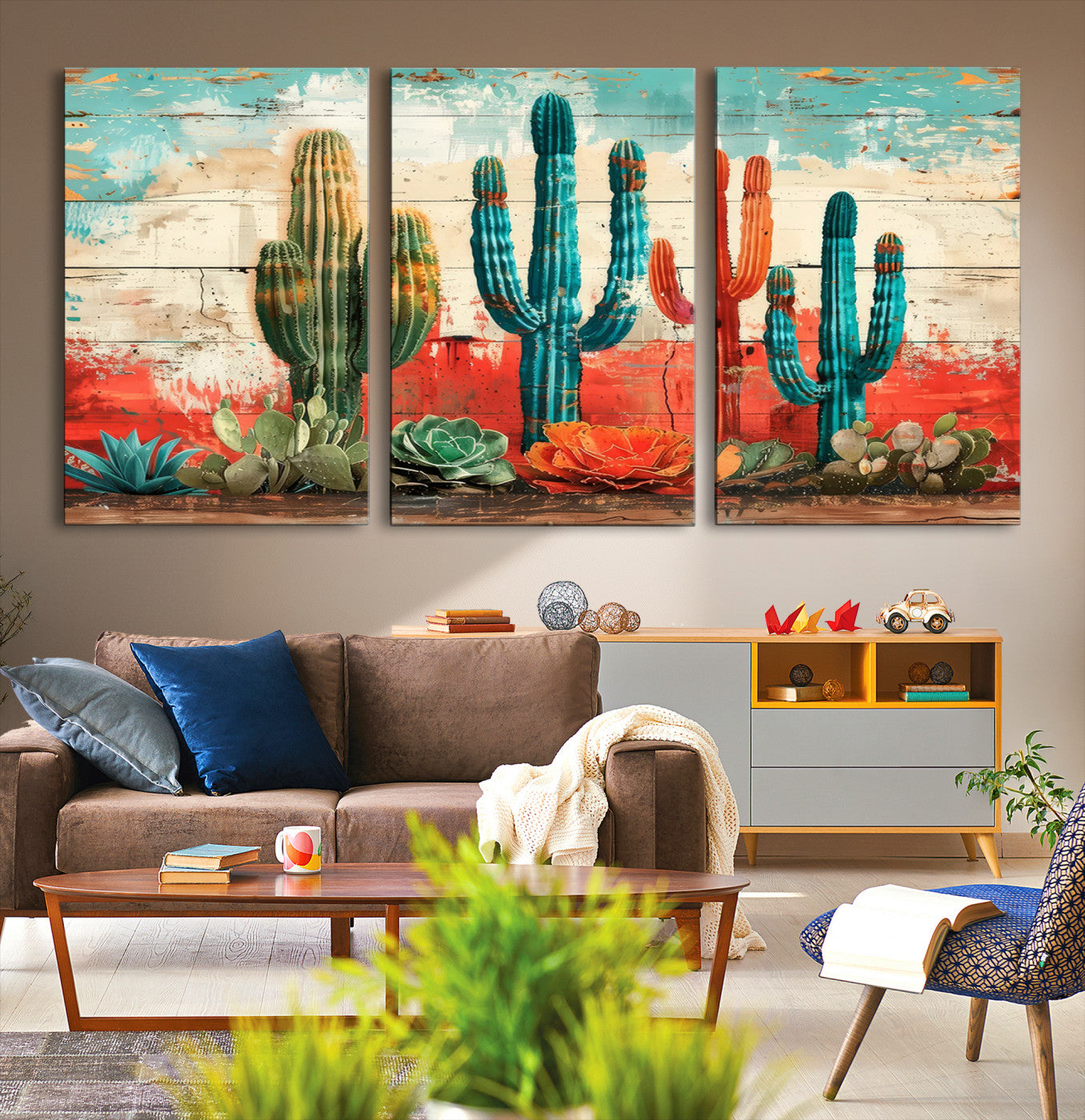 A vivid southwestern-style artwork featuring an eclectic mix of cacti and succulents painted against a textured, rustic wood backdrop in rich turquoise, red, and orange hues.