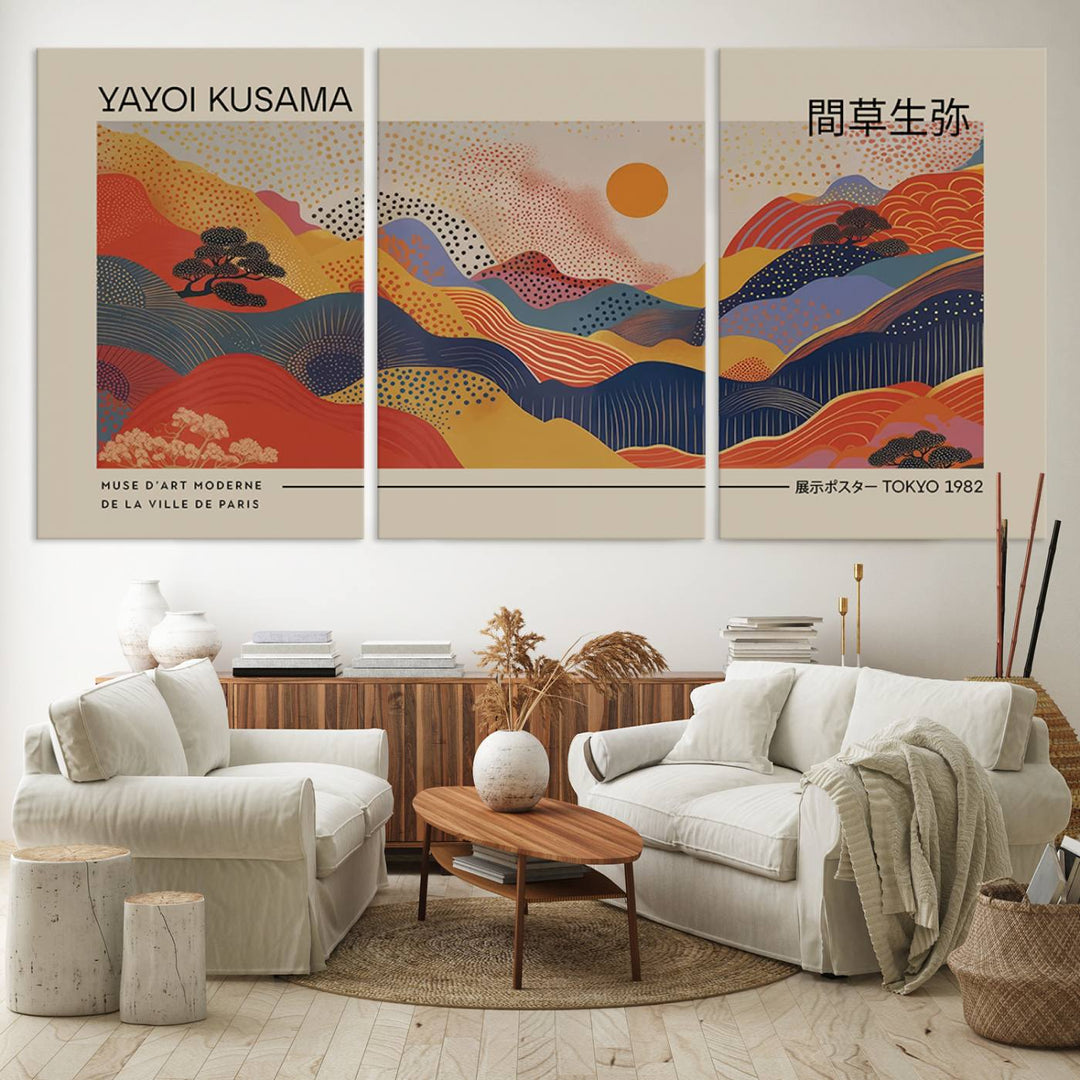 The Yayoi Kusama vibrant landscape canvas print featuring abstract mountains and a sun enhances the space with its modern aesthetic.